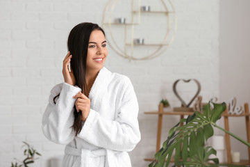 Beautiful young woman after taking bath at home