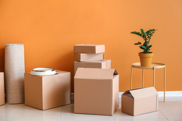 Cardboard boxes with belongings in new flat on moving day