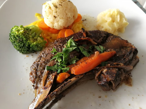 Kleftiko dish cuisine of Cyprus. Stewed lamb meat served with vegetables, herbs and mashed potatoes
