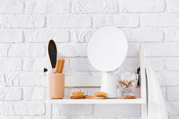 Body care accessories on shelf in bathroom