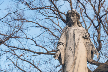 Beautiful Vintage Sculpture at old Catholic cemetery.