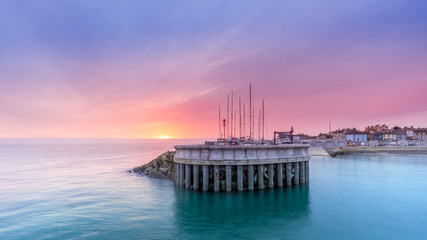 Amazing sky on sunrise at Greystones yacht marina or harbour with boats in dry dock. County...