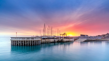 Amazing sky on sunrise at Greystones yacht marina or harbour with boats in dry dock. County...