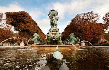 Paris fountain observatory with baroque horses and turtles sculptures in autumn sunny day