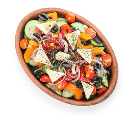 Plate of tasty Greek salad on white background