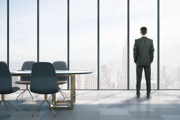 Businessmen standing in meeting room