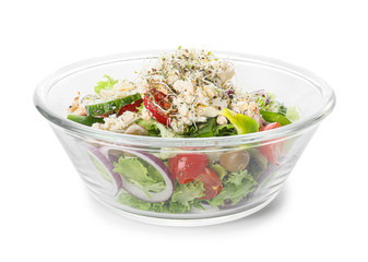 Bowl of tasty Greek salad on white background