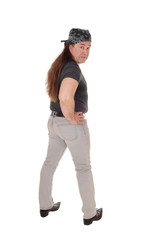 Portrait of a indigenous man standing from the back looking back