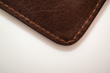 brown leather wallet on white background, purse close-up