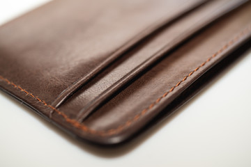 brown leather wallet on white background, purse close-up
