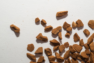 Pile of instant coffee beans isolated on white background