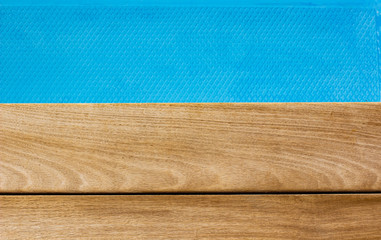 simple background textured wallpaper pattern picture brown wooden deck floor and swimming pool blue water smooth surface horizon board, empty space for copy or text here