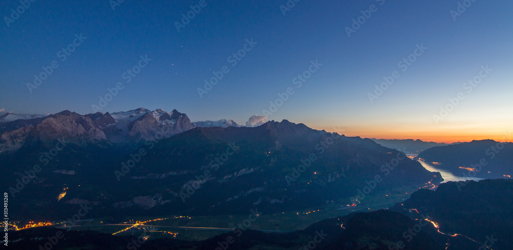 Wall mural scenic view of the swiss alps during late summer or autumn in the evening