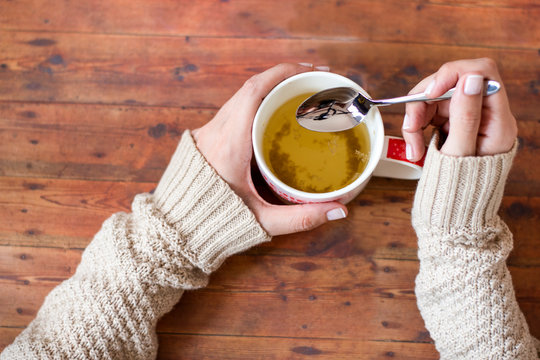 Cup Of Chamomile, Woman Drinking Cup Of Tea Or Coffee On Wooden Background