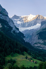 Fototapeta na wymiar Swiss alpine valley catching the morning light