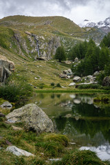 Lake at the tree limit high in the Swiss Alps