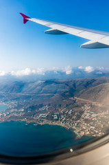 Naklejka na ściany i meble Airplane window view of Crete island coastline, Crete, Greece