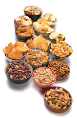 Salty snacks isolated on white