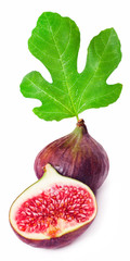 Sliced fresh figs and a fresh green fig leaf isolated on white background