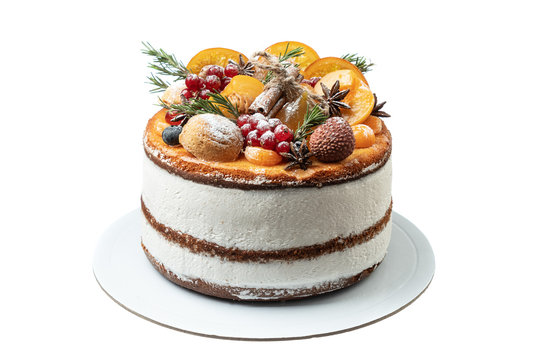 Cake for the winter holidays from fruits and decorations on a white background. - Powered by Adobe