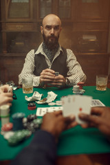 Male hands with cards, poker, games of chance