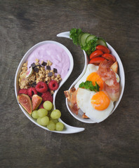 Colorful, healthy and tasty breakfast ingredients  on wooden table