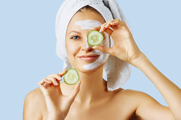 Cosmetology, skin care, face treatment, spa and natural beauty concept. Woman with facial mask on...
