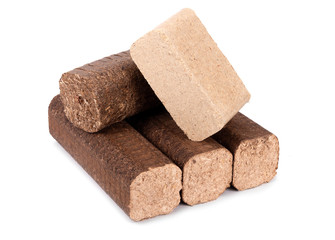 compressed sawdust briquettes heating fuel on a white background