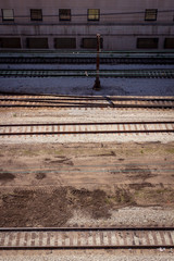 Multiple commuter railway tracks running horizontally seen from above