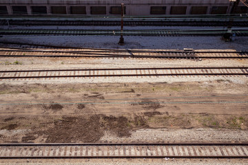 Multiple commuter railway tracks running horizontally seen from above