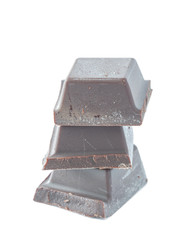 Studio shot heap of Belgian chocolate bar pieces isolated on white