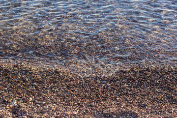 crushed stone and shallow water background beach scenery landscape