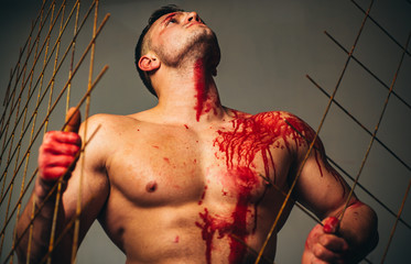 Muscular man nude torso soiled blood. Halloween concept. Scary monster just murdered his victim....