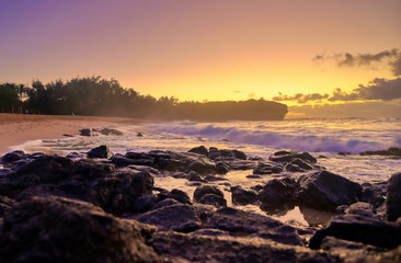 Fototapeta na wymiar The sunrise over the beach in Kauai, Hawaii