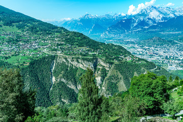 Village of Vex, perched at the top of the cliff, and overlooking the Sion valley. Canton of Valais,