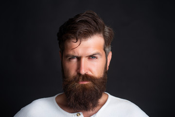 Successful middle eastern business man. Portrait of thinking man isolated over black background.