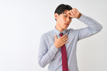 Chinese businessman wearing elegant tie standing over isolated white background Touching forehead for illness and fever, flu and cold, virus sick
