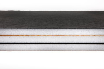 Teflon-coated sound insulation board.Rubber sheet. Piece of square plastic for industrial.