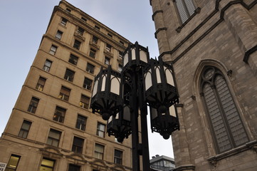 Lamp post and buildings in a city square