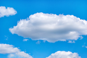 Fluffy white clouds on background of blue sky wallpaper