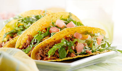 a platter of three tacos