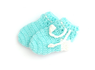 Handmade sweet baby booties isolated on a white background