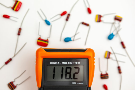 Digital multimeter showing a voltage reading on its display