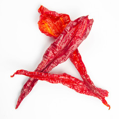 Dried hot red pepper on a white background. Food and spices.