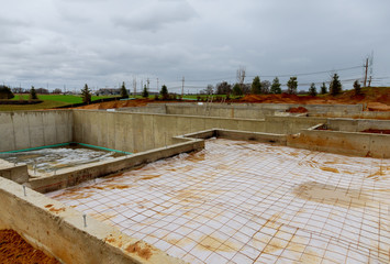 Fototapeta premium House in the foundation for a new building with cement