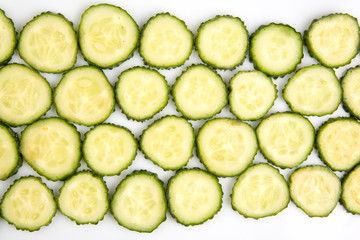 sliced ​​pieces of cucumber on a white background. fast food and breakfast
