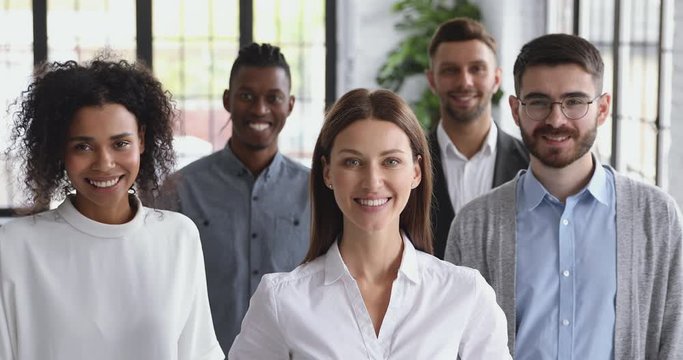 Confident happy diverse business people together in office, corporate portrait