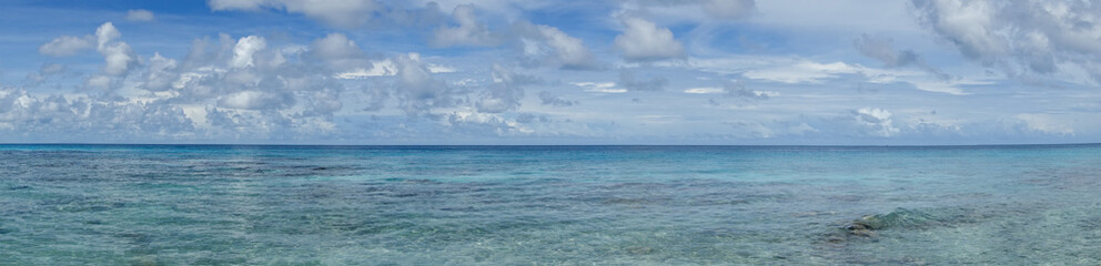 Panorama of blue sky and turquoise water in the Pacific Ocean off Bora Bora in French Polynesia