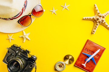 Fototapeta na wymiar Traveler accessories on yellow background with blank space for text. Flat lay, top view travel or vacation concept. Summer background.