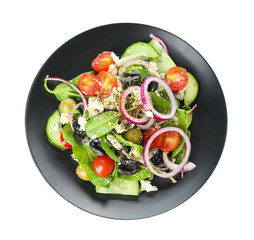 Plate of tasty Greek salad on white background